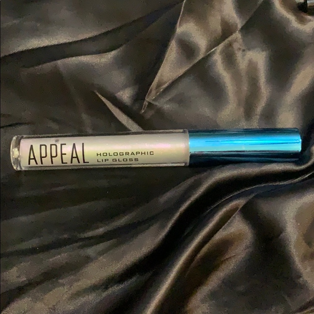 Never opened/used, Appeal holographic lip gloss.